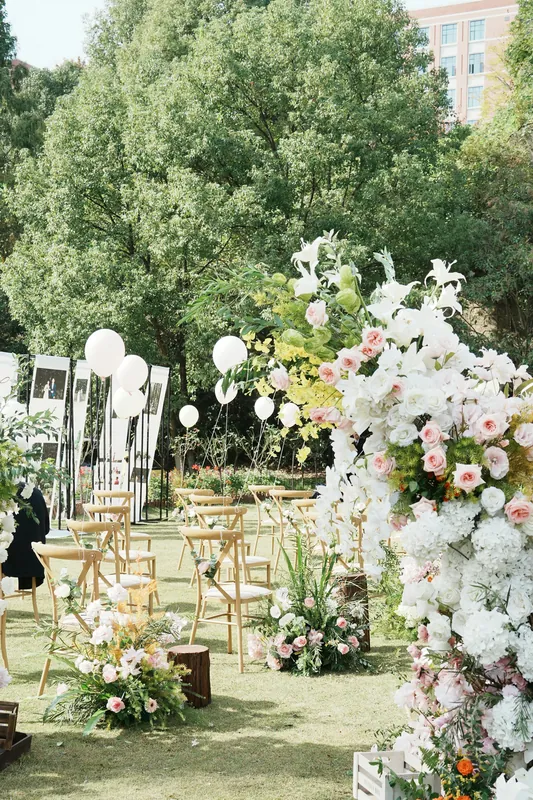 White and blush ceremony flowers in a garden